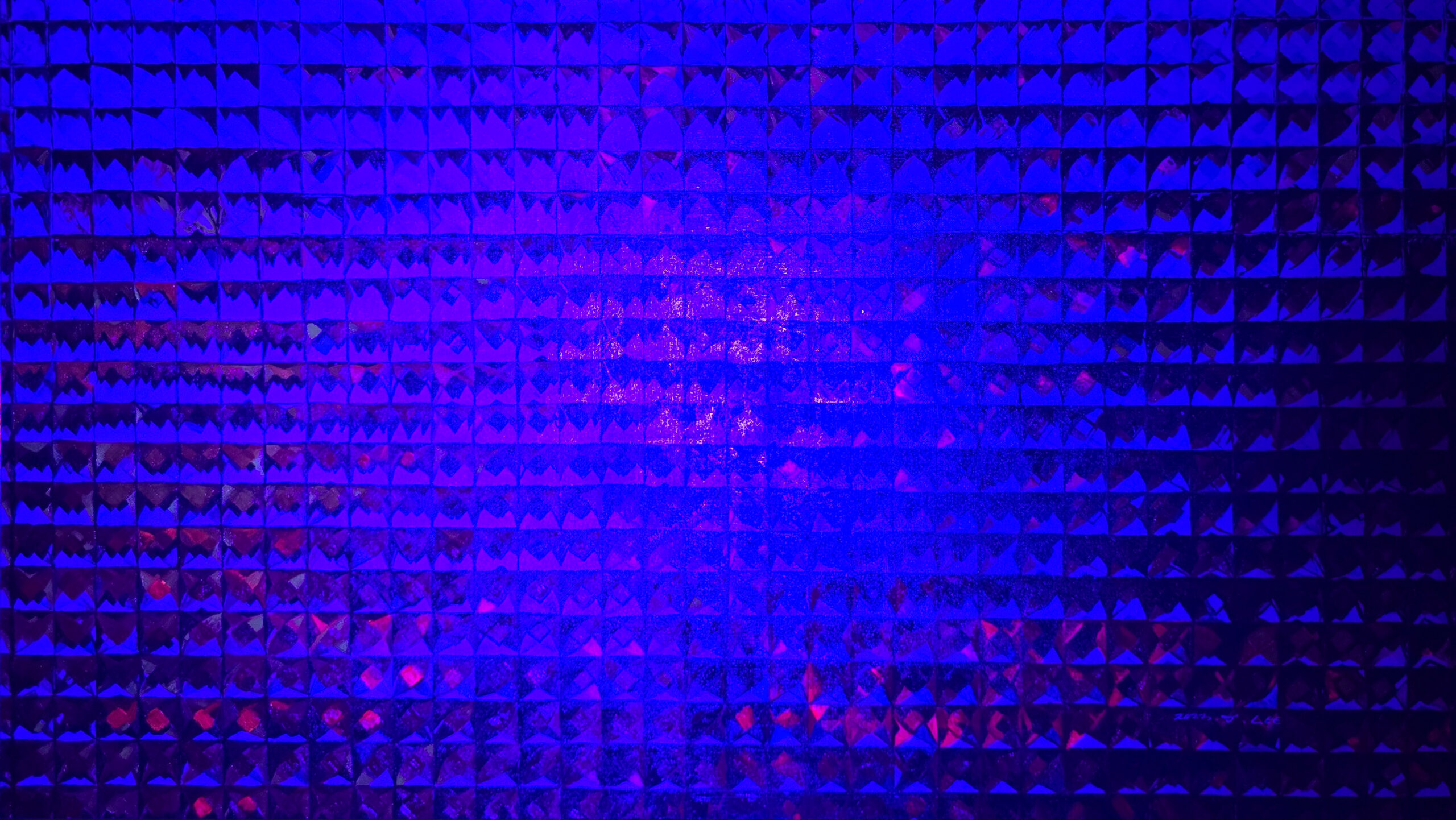Figures in mosaic windows under UV light