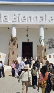 Visitors arriving at the main entrance of La Biennale di Venezia during the 61st International Art Exhibition in Venice, Italy. The iconic white façade welcomes audiences from around the world.